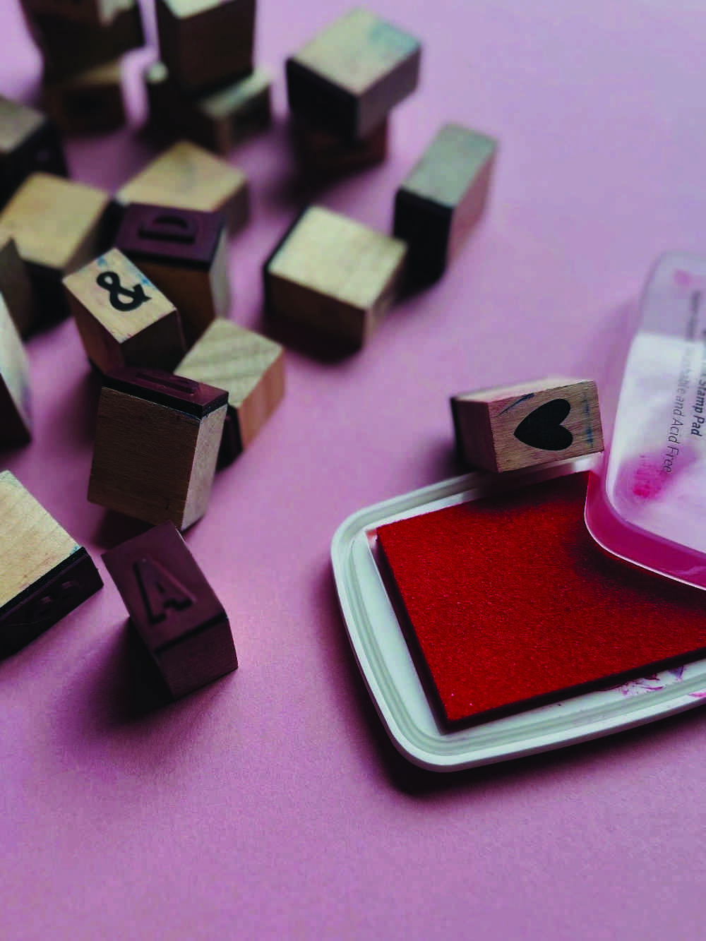 Wooden alphabet stamps and red ink pad