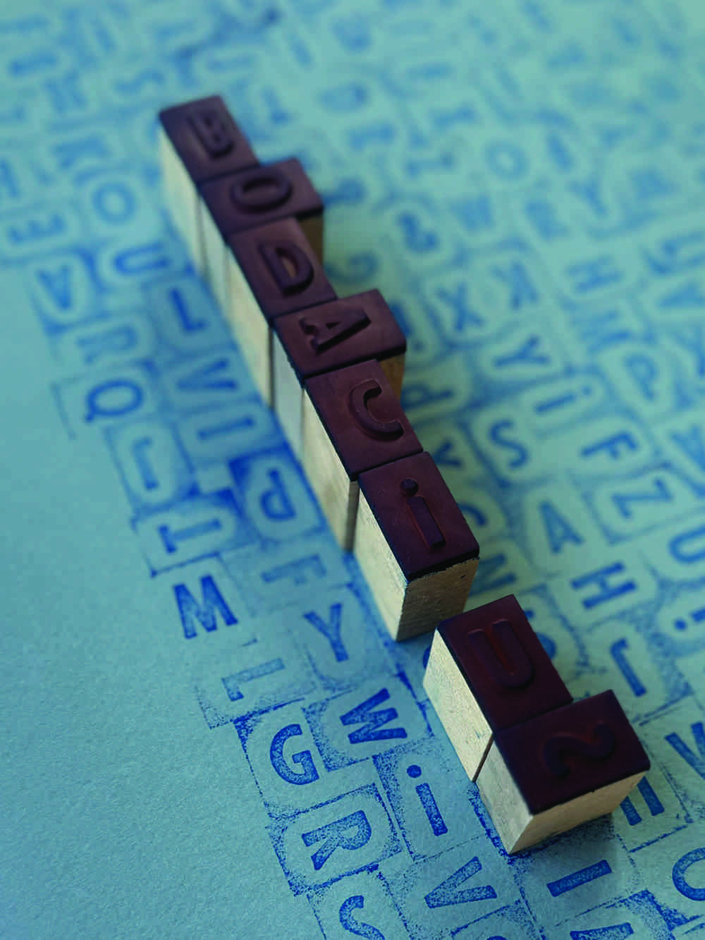 Wooden letter stamps on artwork